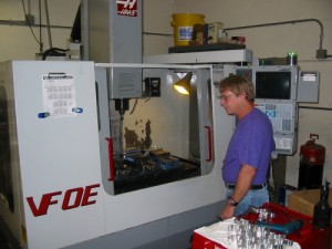 Gary Smith gets ready to load parts for the next operation