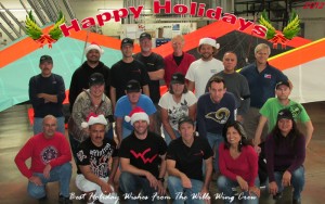 The Wills Wing Crew, 2012: Back, l-r: Moises Cortes, Anthony Faletoi, George Mantoan, Rick Zimbelman, Mike Meier, Johnathon Bland, Martin Maldonado, Ken Howells. Middle, l-r: Eva Hanska, Gary Smith, Becky Harrison, Tom Blaty, Alan King. Front, l-r: Bill Blaty, Carlos Mendosa, Matt Barker, Steven Pearson, Linda Meier, Elizabeth Amaya. (Not pictured: Trish Kells, Chris Wills)