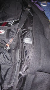 Rolled up harness bag in the new storage compartment